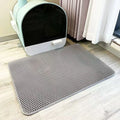 Grey TidyTrap double-layer litter mat in front of a litter box