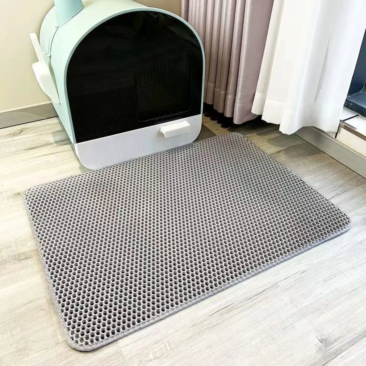 Grey TidyTrap double-layer litter mat in front of a litter box